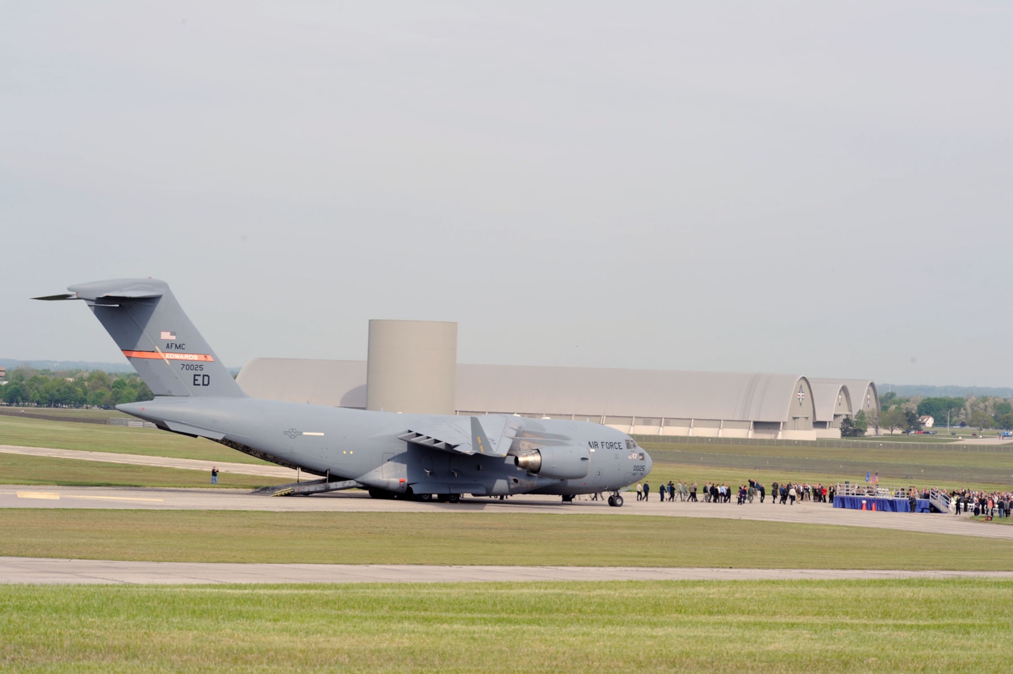 DAYTON, Ohio -- The U.S. Air Force's first C-17 (T-1) arrives at the National Museum of the U.S. Air Force after its final flight on April 25, 2012. This C-17 Globemaster III (S/N 87-0025) was essentially hand-built for the sole purpose of developmental test and evaluation, with an estimated life span of approximately five years. The aircraft was periodically rebuilt and refurbished over the years and its lifespan grew from five to 21 years. (U.S. Air Force photo by Jeff Fisher)