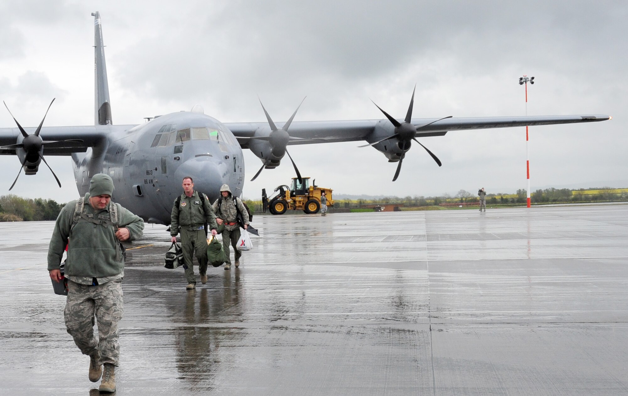 Airmen from the 86th Airlift Wing and the 435th Air Ground Operations Wing arrive at RAF Fairford, April 23, 2012. The Fairford off-station training is used to test Team Ramstein’s ability to deploy its aircraft and supporting assets on short notice while also giving them a chance to perform their mission under real-world situations. (U.S. Air Force photo/Airman 1st Class Trevor Rhynes)