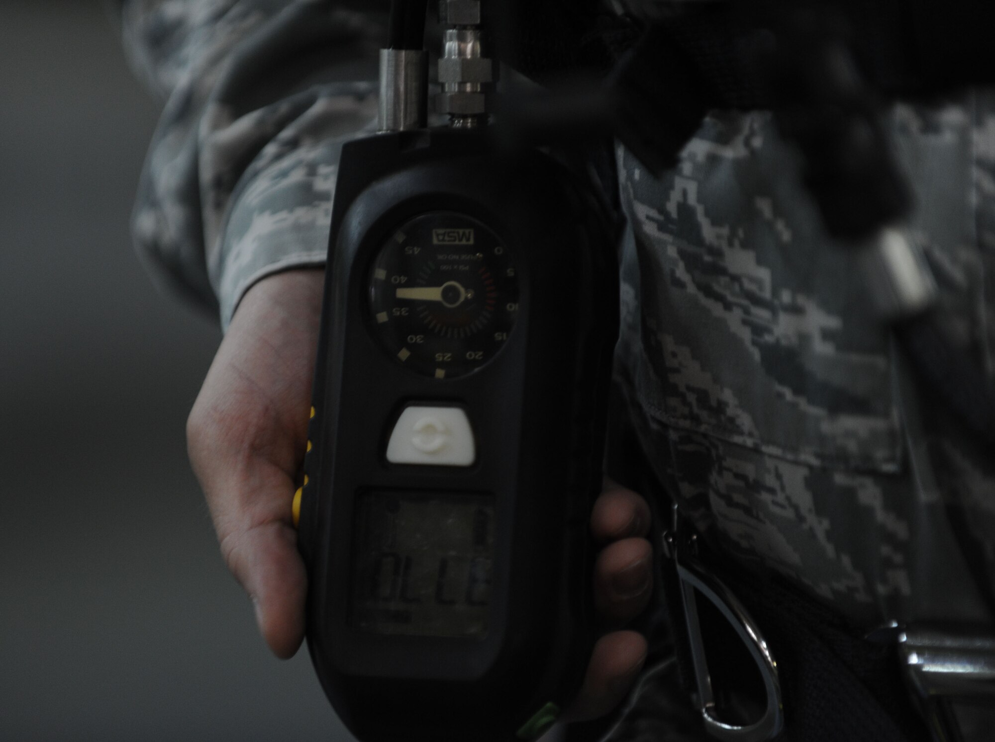 Tech. Sgt. Michael Gonzalez, 39th Civil Engineer Squadron emergency management NCO in charge of training, checks a hazardous materials identification system April 25, 2012, at Incirlik Air Base, Turkey. HMIS is a numerical hazard rating that incorporates the use of labels with color-coded bars as well as training materials. (U.S. Air Force photo by Jarvie Z. Wallace/Released)