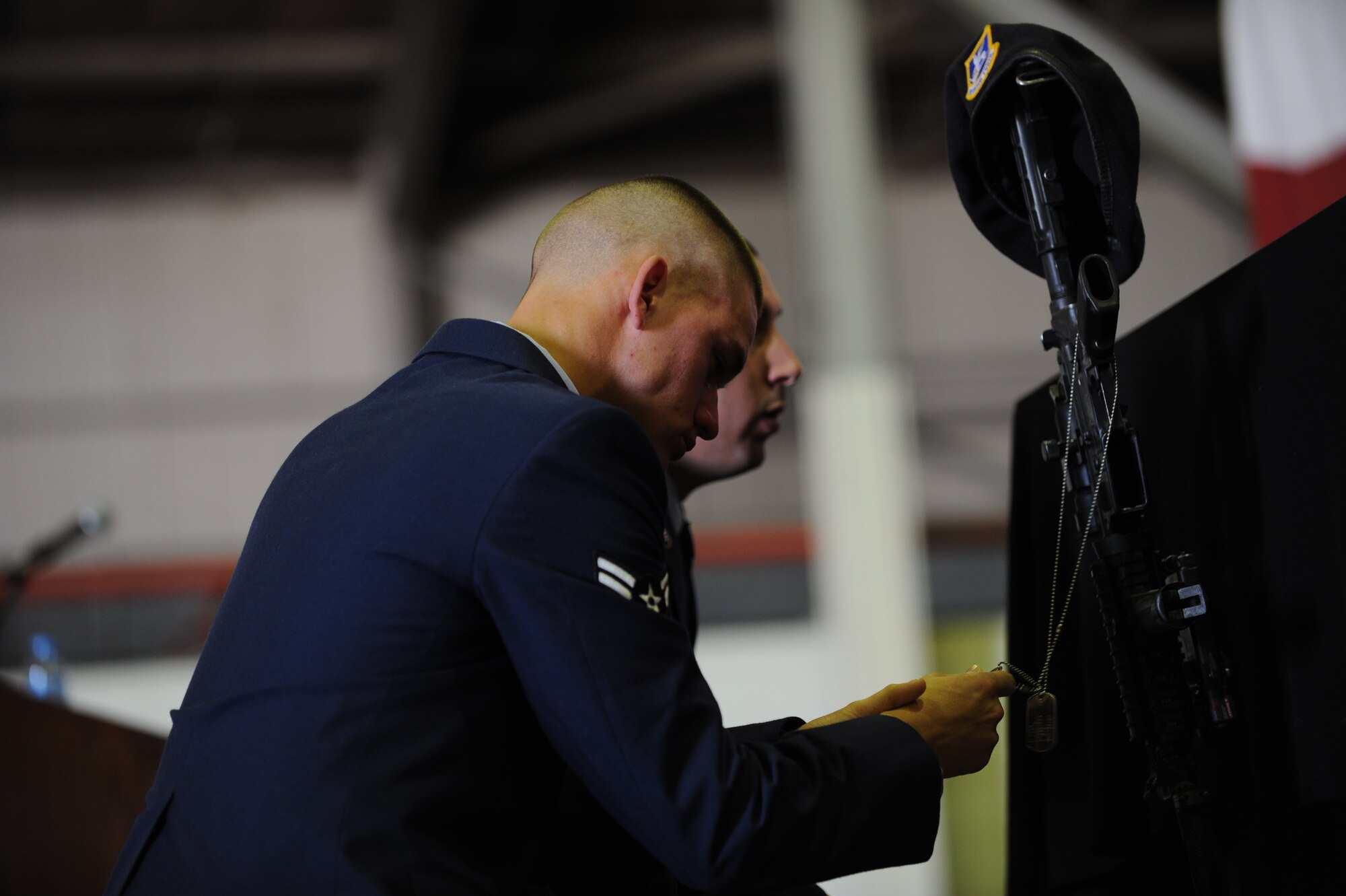 Members of the 39th Security Forces Squadron, kneel in respect during the memorial for Airman 1st Class Floyd Glover April 25, 2012, at Incirlik Air Base, Turkey. The ceremony honored the life of Glover, a 39th SFS security response team member who died April 22. (U.S. Air Force photo by Senior Airman Jarvie Z. Wallace/Released) 