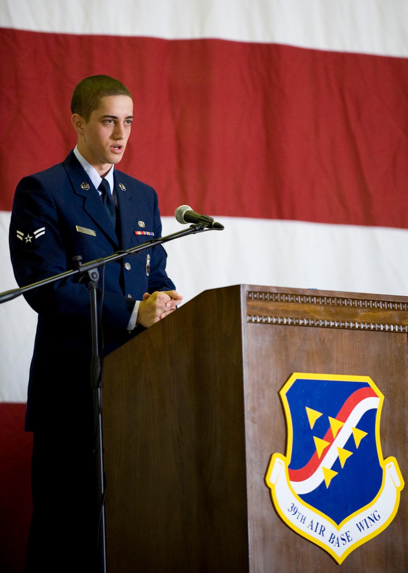 Airman 1st Class Mitchell Gulliver, 39th Security Forces Squadron, delivers a eulogy during the memorial service for Airman 1st Class Floyd Glover April 25, 2012, at Incirlik Air Base, Turkey. The ceremony honored the life of Glover, a member of the 39th SFS Avenger Flight who died April 22. (U.S. Air Force photo by Senior Airman Clayton Lenhardt/Released)