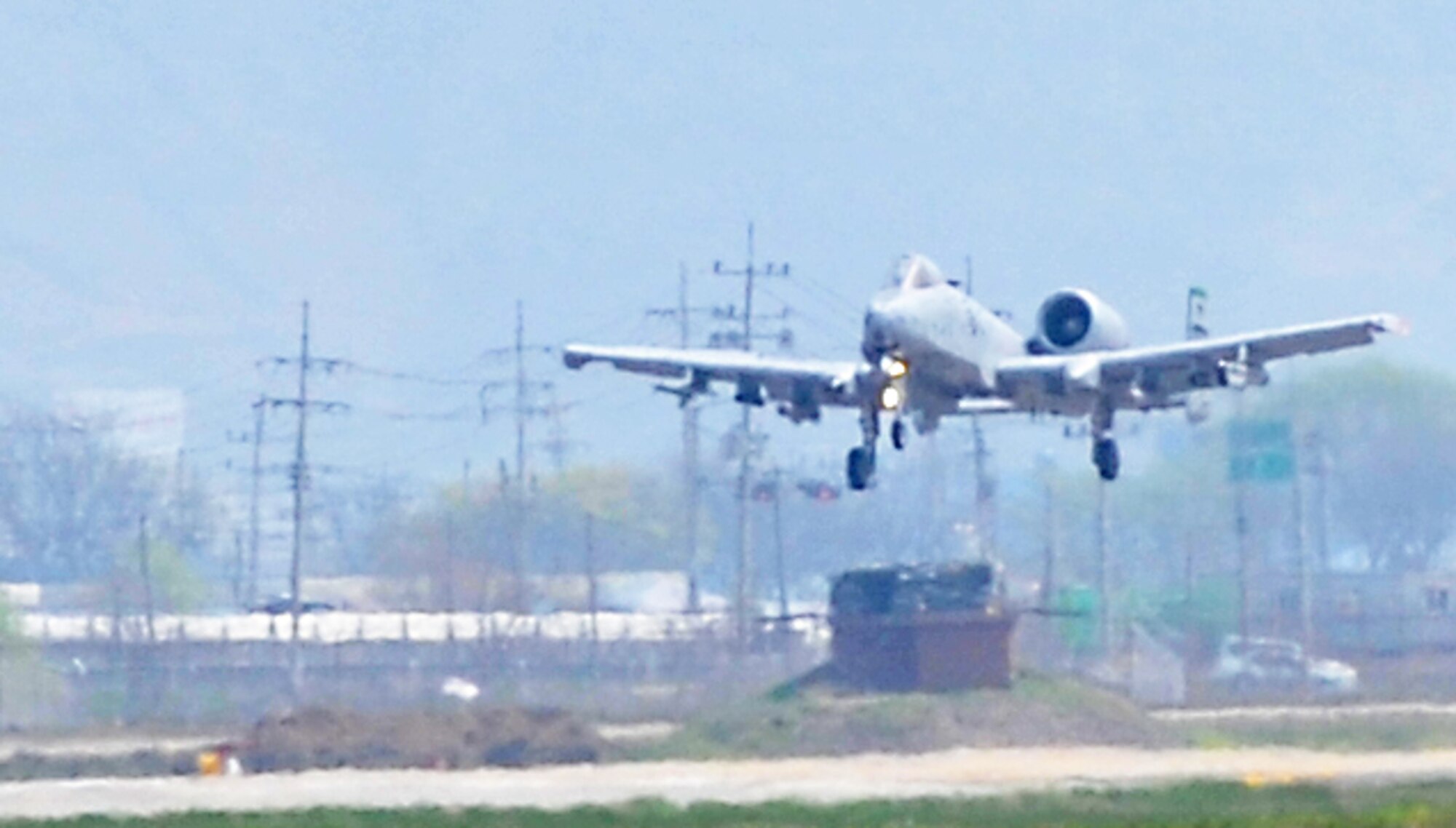 The first A-10 Thunderbolt II sortie for operational readiness exercise Beverly Midnight 12-02 returns to Osan Air Base, April 24, 2012. Beverly Midnight 12-02 is the second half of a two-week consolidated unit inspection where Osan Air Base Exercise Evaluation Team members are graded by Pacific Air Force inspectors on how well they conduct an ORE. Osan’s Airmen provide combat ready forces for close air support, air strike control, counter air, interdiction, theater airlift, and communications in the defense of the Republic of Korea, and the ORE tests these abilities during a heightened state of readiness. (U.S. Air Force photo/Staff Sgt. Stefanie Torres)
