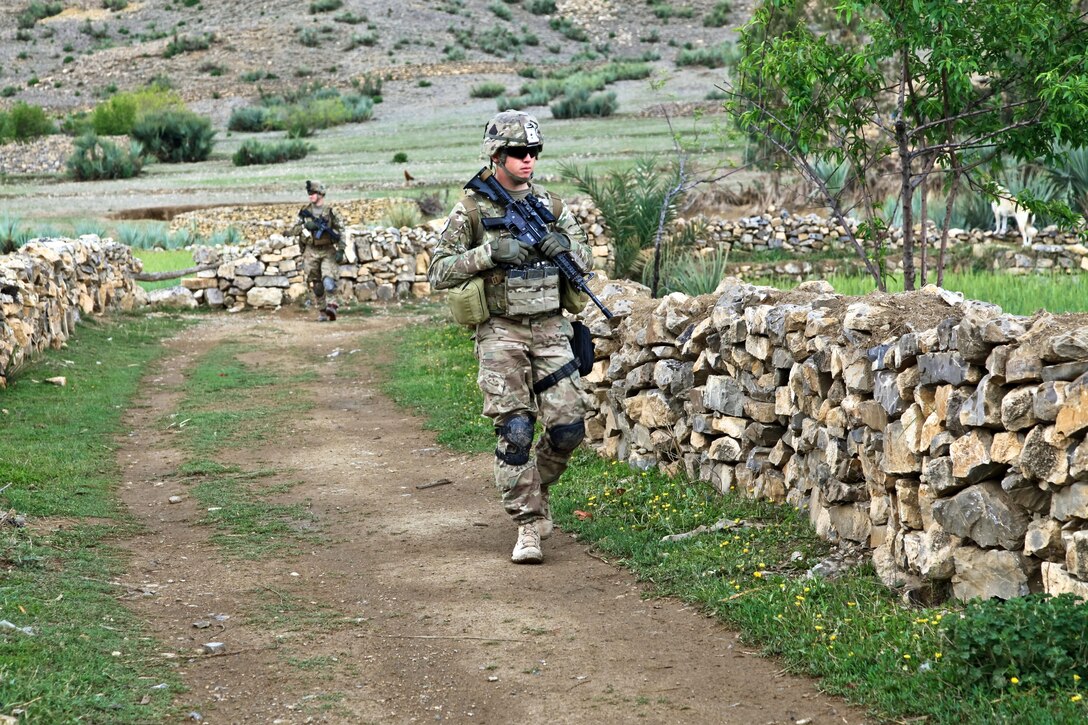 U.S. Army Spc. Cory Bell patrols during Task Force Blue Geronimo in Taghawarq village in Afghanistan's Khost province, April 14, 2012. Bell is assigned to Company B, 1st Battalion, Airborne, 501st Infantry Regiment. The soldiers and Afghan Border Police searched the village for a reported weapons cache to deny insurgents freedom of movement.