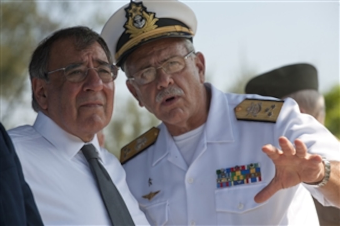 Secretary of Defense Leon E. Panetta observes a Brazilian Marine Corps demonstration with Adm. Ferando Antonio at Governor's Island Marine Base, Rio de Janeiro, Brazil, April 25, 2012.  Panetta is on a five-day trip to the region to meet with counterparts and military officials in Brazil, Colombia and Chile to discuss an expansion of defense and security cooperation.  