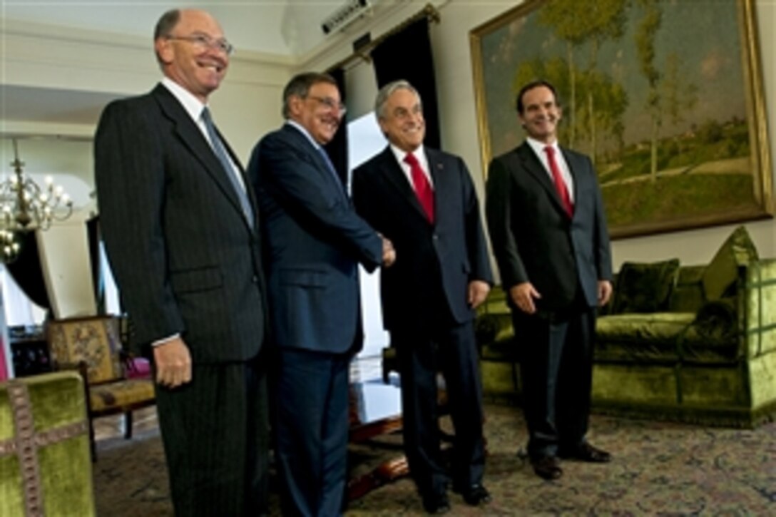 U.S. Defense Secretary Leon E. Panetta, second from left, shakes hands with Chilean President Sebastián Piñera as U.S. Ambassador to Chile Alejandro D. Wolff, far left, and  and Chilean Defense Minister Andrés Allamand look on at the Presidential Palace in Santiago, Chile, April 26, 2012. Panetta is on a five-day trip to the region to meet with counterparts and military officials in Colombia, Brazil and Chile to discuss an expansion of defense and security cooperations.