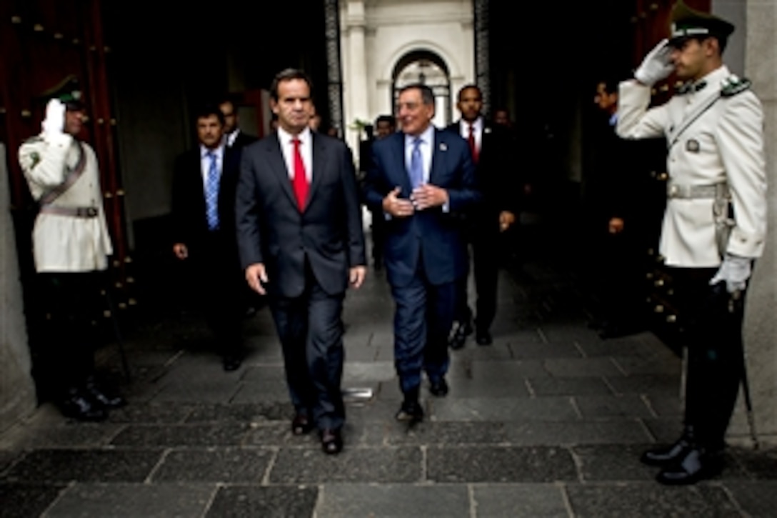 U.S. Defense Secretary Leon E. Panetta, right, and Chilean Defense Minister Andrés Allamand leave the Chilean Presidential Palace after meeting with Chilean President Sebastián Piñera in Santiago, Chile, April 26, 2012. Panetta is on a five-day trip to the region to meet with counterparts and military officials in Colombia, Brazil and Chile to discuss an expansion of defense and security cooperations.