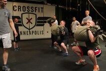 Rob Gerdes, former ground intelligence officer with 3rd Reconnaissance Battalion, watches Marines with Recruiting Station Twin Cities conduct seabag cleans during a CrossFit re-certification course April 27. For additional imagery from the event, visit www.facebook.com/rstwincities.
