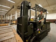 Airman 1st Class Adam Hongisto, 28th Logistics Readiness Squadron central storage technician, moves a pallet of aircraft parts intended for shipment to Dyess Air Force Base, Texas, in the storage and issue facility at Ellsworth Air Force Base, S.D., April 25, 2012. With access to thousands of parts, storage and issue supports B-1 bomber aircraft parts both at Ellsworth and Dyess AFB. (U.S. Air Force photo by Airman 1st Class Kate Thornton/Released)  
