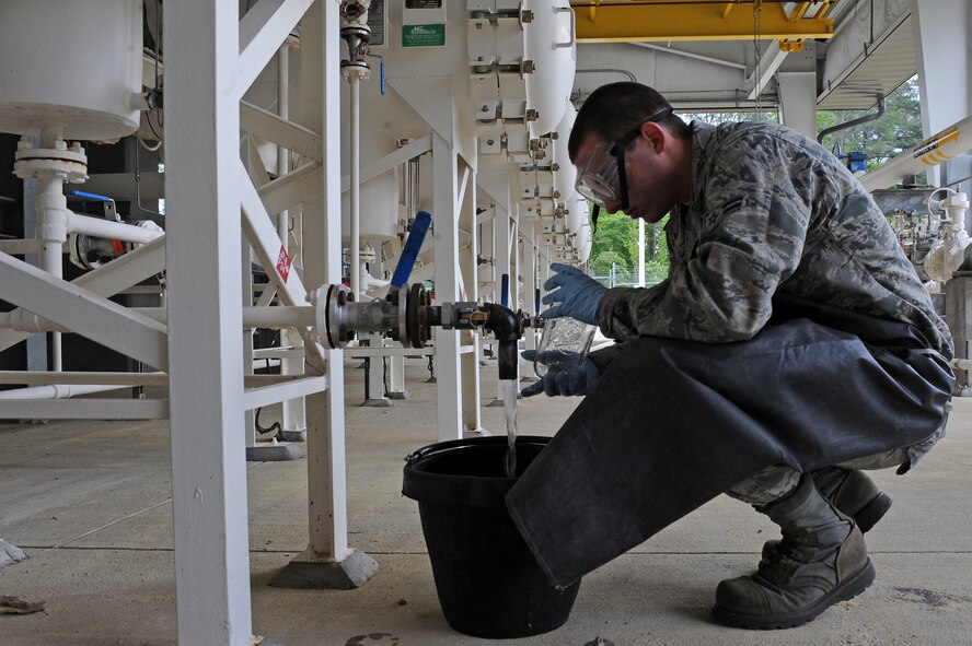 U.S. Air Force Airman 1st Class Charles Jones drains water from a filter separator on Seymour Johnson Air Force Base, N.C., April 25, 2012. Water is extracted from the filters prior to refueling F-15E Strike Eagles to prevent engine failure. Jones, 4th Logistics Readiness Squadron fuels distribution operator, is from Panama City, Fla. (U.S. Air Force photo/Airman 1st Class John Nieves Camacho/Released)