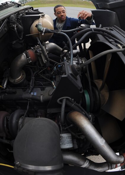 U.S. Air Force Staff Sgt. Dorell Pettus replaces the cap on the power steering component of an R-11 refueling truck on Seymour Johnson Air Force Base, N.C., April 25, 2012. R-11 refueling trucks are used to refuel F-15E Strike Eagles and can dispense fuel at a rate of 600 gallons per minute. Pettus, 4th Logistics Readiness Squadron refueling maintenance supervisor, is from Charlotte, N.C. (U.S. Air Force photo/Airman 1st Class John Nieves Camacho/Released)