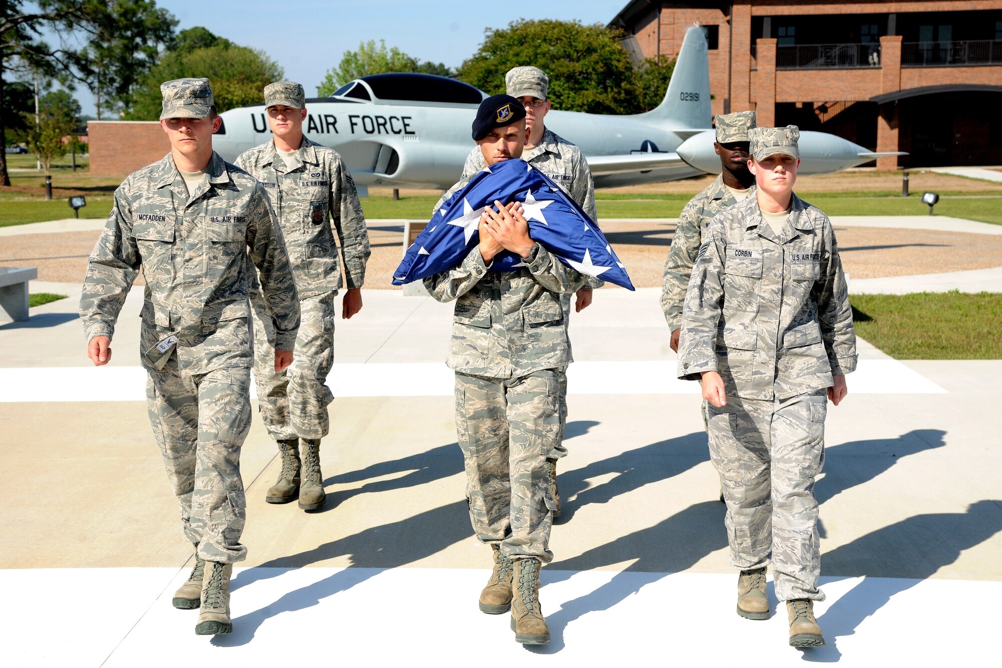 Members of Team Moody  retire the flag during a retreat ceremony at the George W. Bush Air Park at Moody Field at Moody Air Force Base, Ga., April 26, 2012. The retreat ceremony signifies the end of the official duty day and when participants pay respects to the American flag and the nation. (U.S. Air Force photo by Airman 1st Class Paul Francis/Released)
