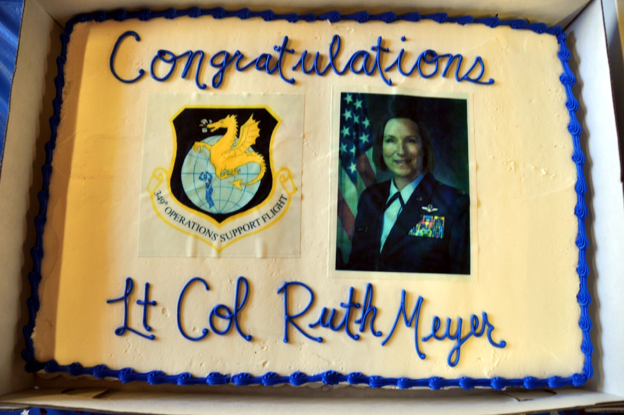 TRAVIS AIR FORCE BASE, Calif. -- Lt. Col. Ruth Meyer (right), 349th Operations Support Flight commander, accepts the guidon from Col. Matthew Burger, 349th Operations Group commander, during an assumption of command ceremony at Travis Air Force Base, Calif., on April 22, 2012. The passing of the guidon symbolizes a new commander assuming his or her duties as the leader of an organizational unit. (U.S. Air Force photo/Tech. Sgt. Rachel Martinez)