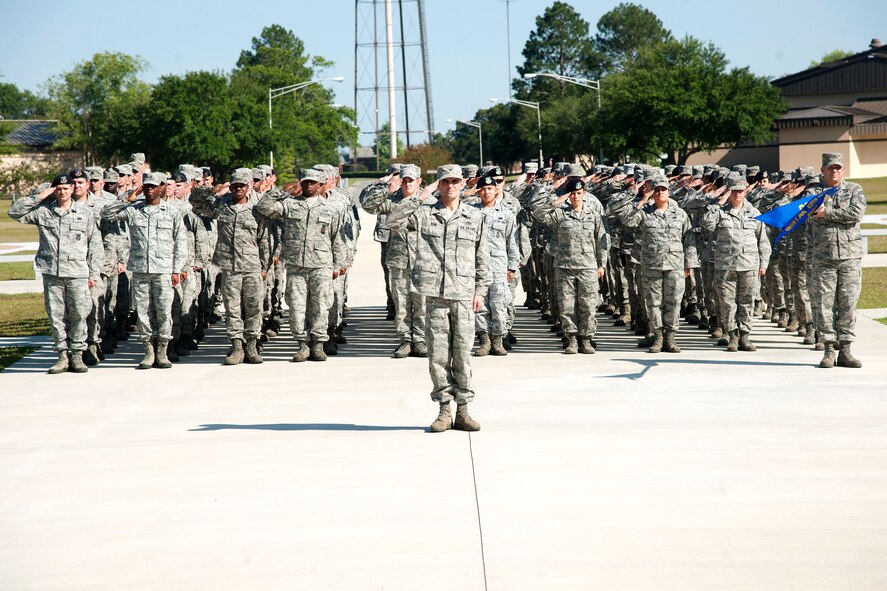 U.S. Air Force Airmen from the 23d Mission Support Group salute the flag during a retreat ceremony at the George W. Bush Air Park at Moody Field on Moody Air Force Base, Ga., April 26, 2012. Each month, members from different squadrons around the 23d Wing conduct the ceremony, signaling the end of the official duty day. (U.S. Air Force photo by Airman 1st Class Paul Francis/Released)
