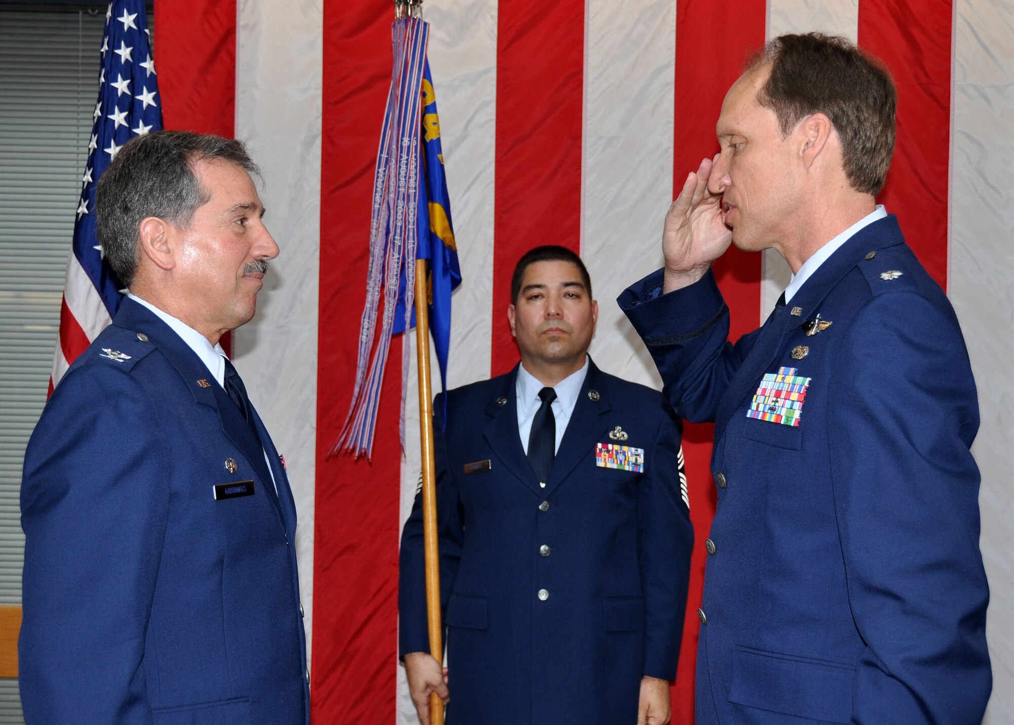 TRAVIS AIR FORCE BASE, Calif. -- Lt Col. David Emery accepts command of the 749th Aircraft Maintenance Squadron with a salute to Col. Melvin Giddings Jr., during a change of command ceremony at Travis Air Force Base, Calif., on April 21, 2012. (U.S. Air Force photo/Tech. Sgt. Rachel Martinez)