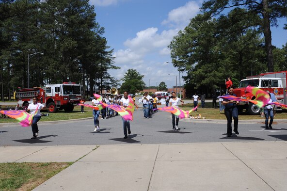 Eastern Wayne High School’s marching band performs in front of the youth center during Month of the Military Child information fair on Seymour Johnson Air Force Base, N.C., April 21, 2012. Other performances included Stage Struck, The Young People’s Theatre, The Boys & Girls Club drum line and Goldsboro Elite martial arts. (U.S. Air Force photo/Airman 1st Class John Nieves Camacho/Released)