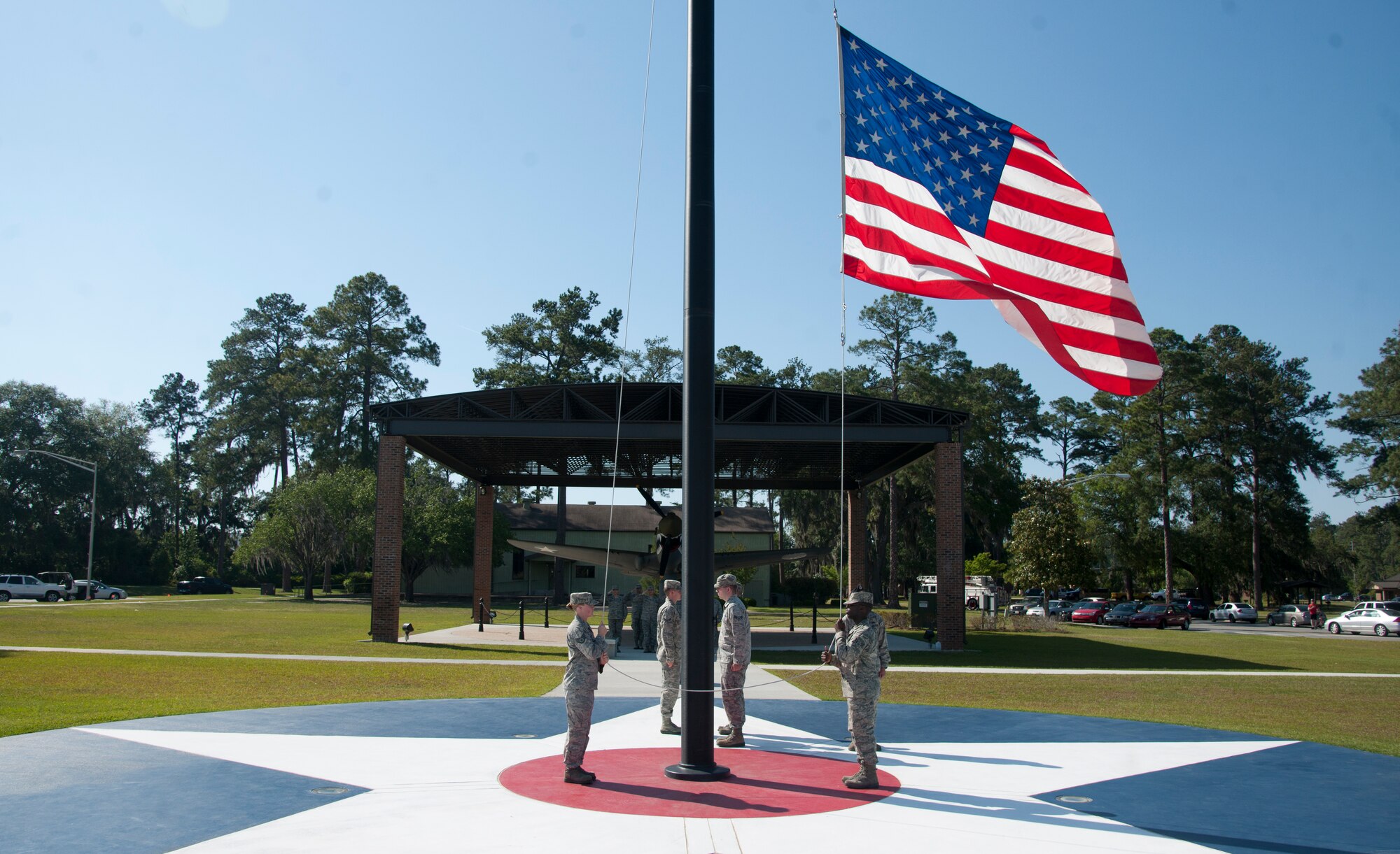 U.S. Air Force Airmen from the 23d Mission Support Group lower the flag during a retreat ceremony at the George W. Bush Air Park at Moody Field at Moody Air Force Base, Ga., April 26, 2012 The retreat ceremony signals the end of the official duty day and has been a tradition since the Revolutionary War. (U.S. Air Force photo by Airman 1st Class Paul Francis/Released)
