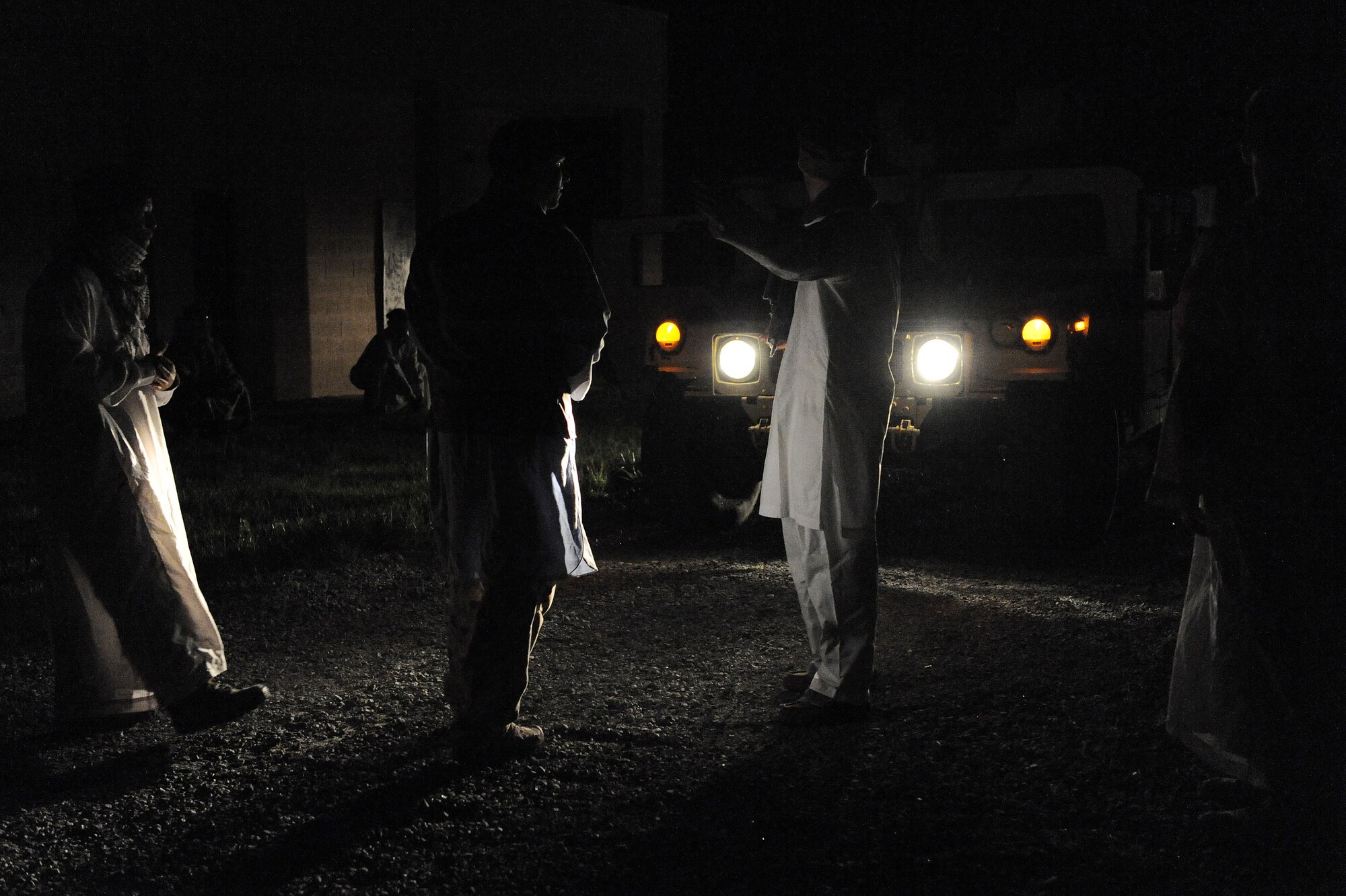 U.S. Air Force 820th Base Defense Group Airmen dressed as Afghan civilians protest a convoy at the military operations in urban terrain village at Moody Air Force Base, Ga., April 25, 2012.  MOUT village is designed to portray a realistic setting for Airmen in training that depicts how an actual deployed setting might be seen by an outside observer. (U.S. Air Force photo by Staff Sgt. Ciara Wymbs/Released)  