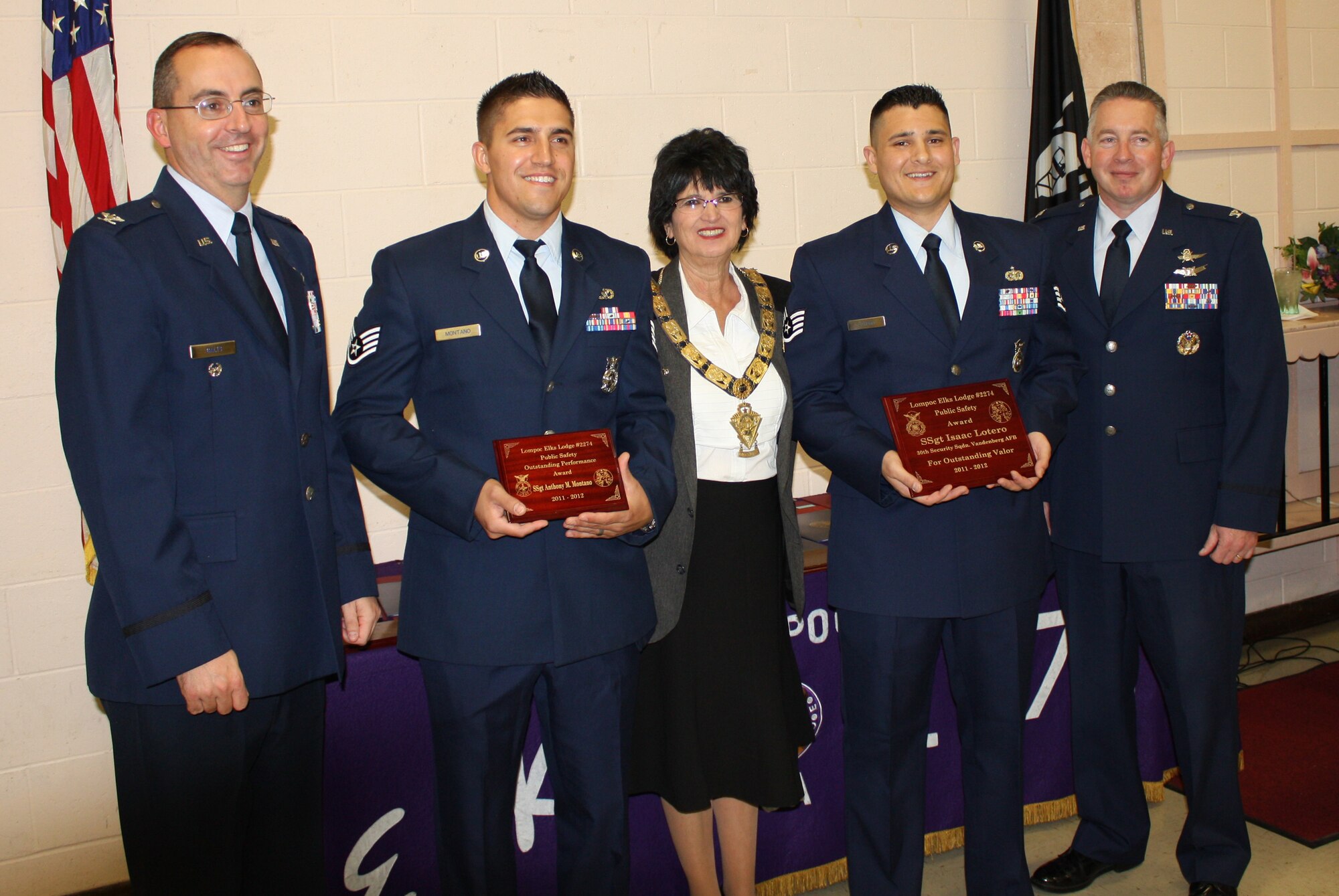 VANDENBERG AIR FORCE BASE, Calif. – Col. Keith Balts, 30th Space Wing vice commander; Staff Sgt. Anthony Montano, a 30th Civil Engineer Squadron firefighter; Sylvia Boynton, Lompoc Elks exalted ruler; Staff Sgt. Isaac Lotero, a 30th Security Forces Squadron patrolman and Col. Kelly Kirts, 30th Mission Support Group commander, pose for a photo Thursday, April 19, 2012.  Montano won an Outstanding Performance Award and Lotero won the Elks Valor Award at the Lompoc Elks Lodge Public Employees Safety Night. (Courtesy Photo)