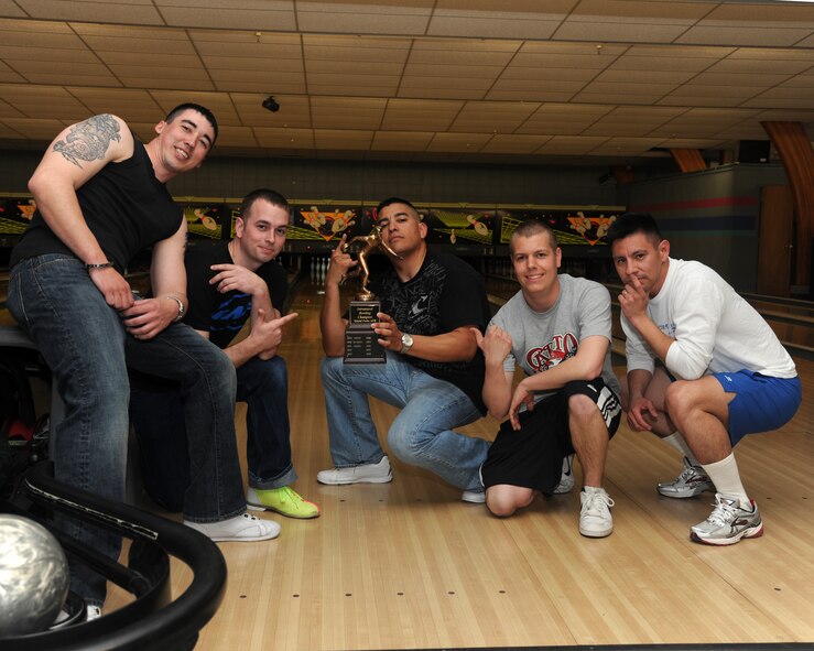 Members of the 319th Logistics Readiness Squadron pose with squadron commander Maj. Rey Gonzales, right, after winning the Intramural bowling championship on April 27, 2012, at Grand Forks Air Force Base, N.D.  The 319th LRS defeated the 69th Reconnaissance Group for the championship trophy. (U.S. Air Force photo/Airman 1st Class Ashley N. Taylor)