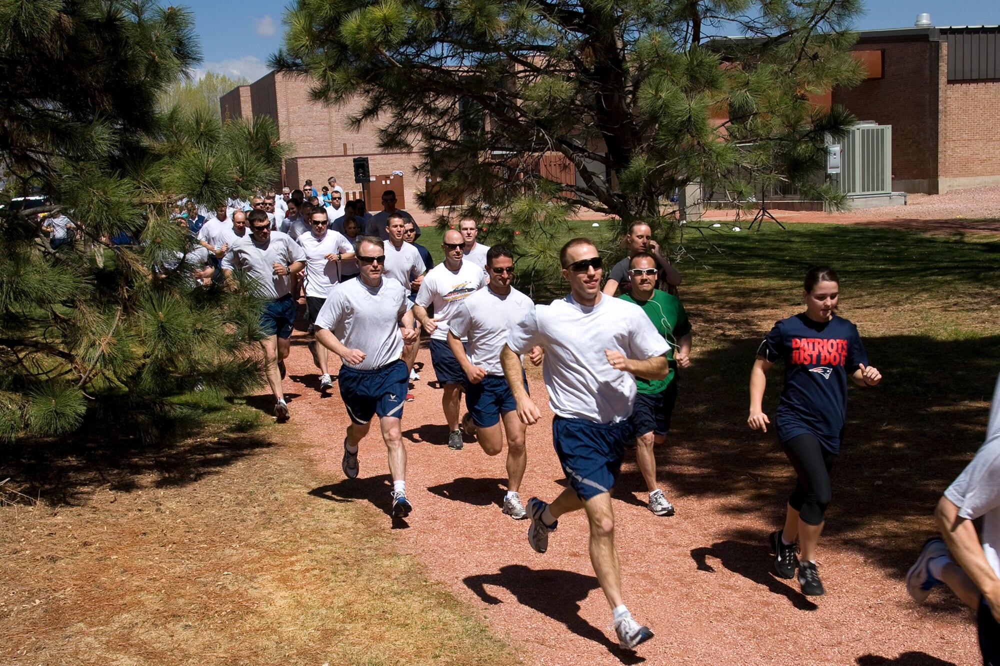 Runners launch into this year’s Sexual Assault Awareness Month 5K fun run April 20 at the fitness center. Held by the Sexual Assault Prevention and Response office, the run is intended raise awareness during sexual assault awareness month. Victim advocates gave out SAAM T-shirts, towels and bracelets to those in attendance. (U.S. Air Force photo/Craig Denton)