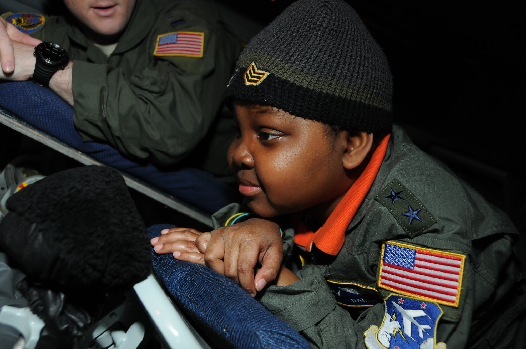 Darion Thorne, dressed a major general, and his wingman for life, 1st Lt. Brandon Splawn, a 201st Airlift Squadron mission pilot, sit in the back of a KC-135 at the 459th Air Refueling Wing during a day in which Darion was appointed a pilot for the Pilot for a Day program, April 26, 2012. Darion is a terminally ill child diagnosed with Diffuse Intrinsic Pontine Glioma, which is a tumor on the brain stem. (U.S. Air Force photo/ Senior Airman Katie Spencer)
