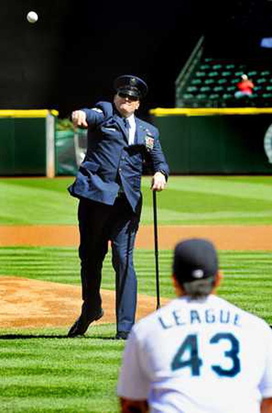 Tech. Sgt. Keith Sekora, 446th Civil Engineer Squadron Explosive Ordnance Disposal Flight, throws out a pitch during the Seattle Mariners' 10th Annual Salute to Armed Forces April 21.  (U.S. Army photo by Scott Hansen/Northwest Guardian)
