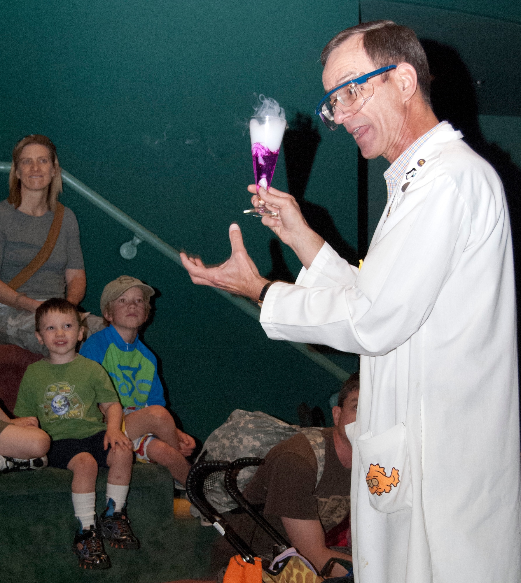 Dr. Ron Furstenau explains the chemical reaction taking place between water and dry ice during a chemistry magic presentation at Garden of the Gods April 21, 2012. Furstenau, an instructor with the Air Force Academy's Chemistry Department, first became interested in chemistry in ninth grade. He graduated from the Academy in 1978, returning to teach there in 1984 and again in 1990. (U.S. Air Force photo/Don Branum)