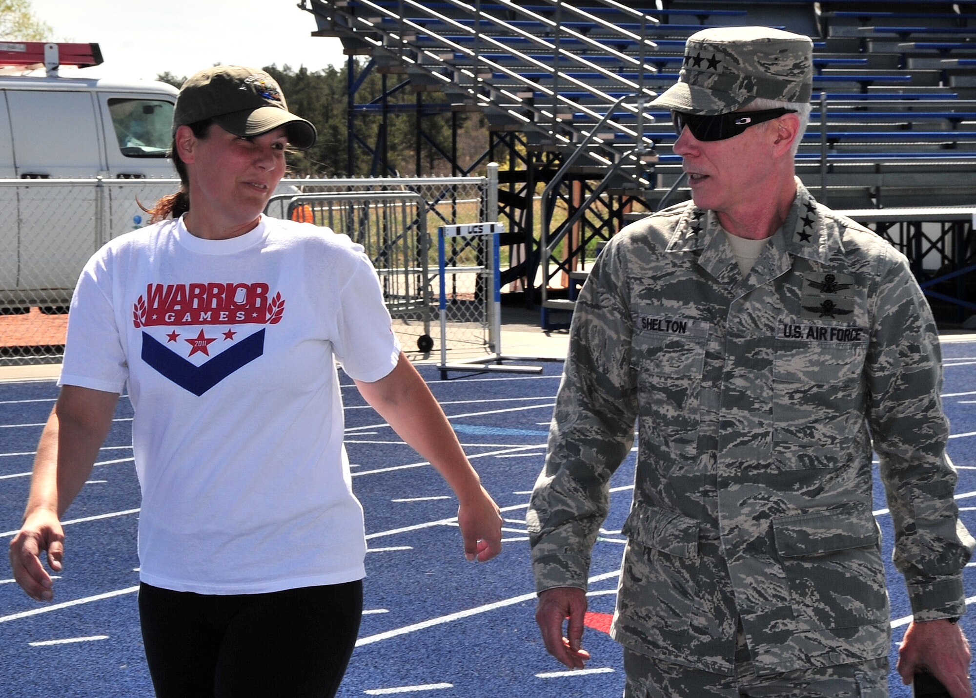 Gen. William L. Shelton, Commander, Air Force Space Command, talks with retired Staff Sgt. Stacy Pearsall who is competing in the Warrior Games at the U.S. Air Force Academy, Colo. April 25. Warrior Games serves as an introduction to Paralympic sport, while at the same time builds camaraderie and raises awareness of adaptive sports. (U.S. Air Force photo/Duncan Wood)