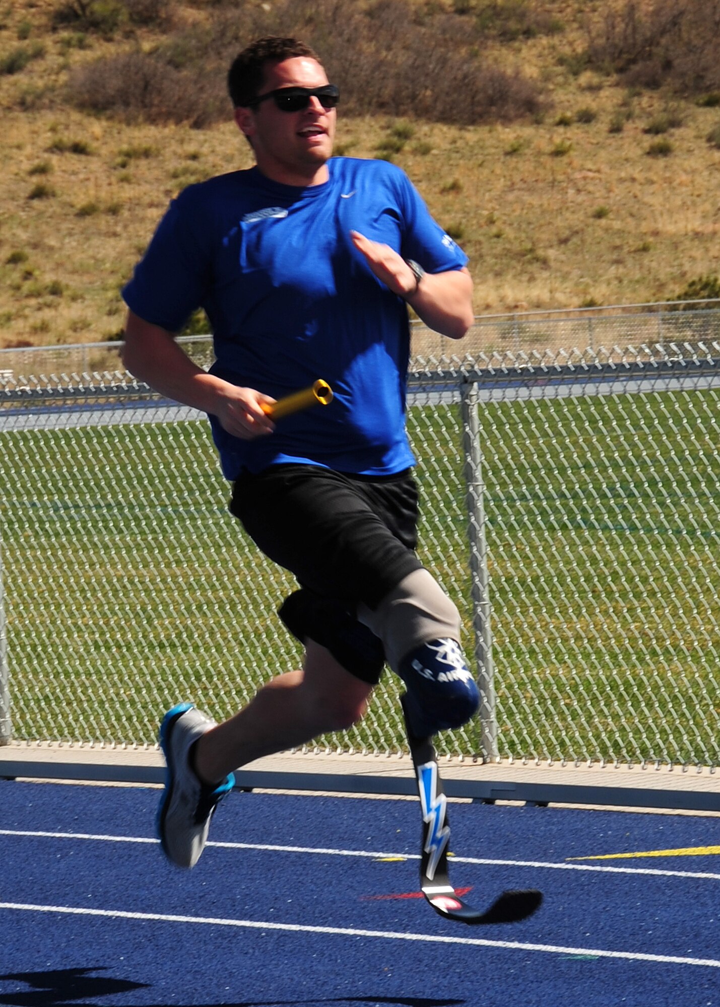 1st Lt. Ryan McGuire competes in a relay race during the Warrior Games at the U.S. Air Force Academy, Colo. April 25. McGuire is a C-17 pilot assigned to the 4th Airlift Squadron, Joint Base Lewis-McChord, Wash. Warrior Games serves as an introduction to Paralympic sport, while at the same time builds camaraderie and raises awareness of adaptive sports. (U.S. Air Force photo/Duncan Wood)