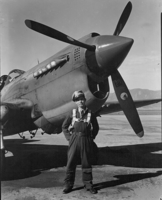 1st Lt. Comer Lynn stands in front of a P-40 "Warhawk" fighter. Lynn was an instructor with the fighter pilot training school based at Peterson Field from 1944-45. (U.S. Air Force photo)
