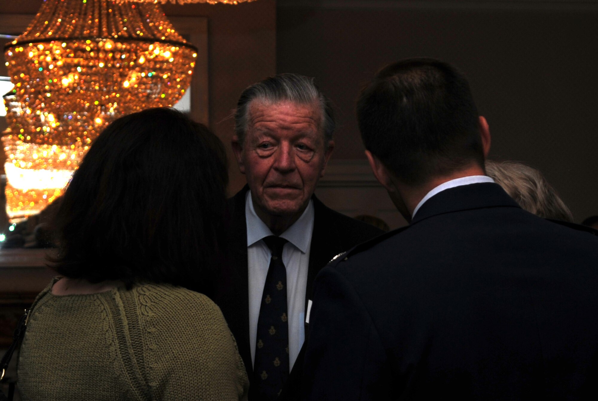 RAF MILDENHALL, England – Sir Michael Oswald (center), racing advisor to Her Majesty the Queen and newly appointed 100th Air Refueling Wing honorary vice-commander, speaks with Nicole Kulas and Col. Christopher Kulas, 100th ARW commander, after the Honorary Commanders’ Induction Ceremony at Middleton Hall April 26, 2012. Sir Oswald formerly was the 100th Mission Support Group honorary commander. (U.S. Air Force photo/Senior Airman Rachel Waller) 
