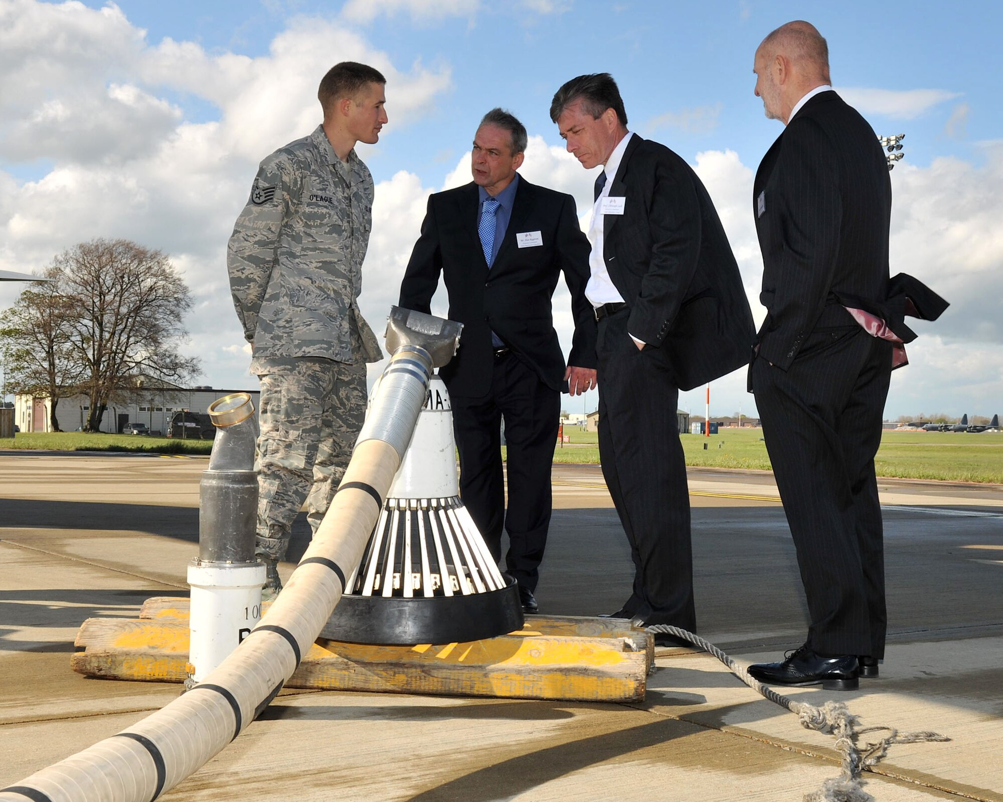 RAF MILDENHALL, England – Staff Sgt. Michael O’Lague, 100th Aircraft Maintenance Squadron, explains the features of the drogue refueling system to a few of the newest members of the base Honorary Commander program on the flightline here April 26, 2012. The program extends an invitation to distinguished members of the local community to serve as honorary commanders of base units in an attempt to build and strengthen the relationship between the military and British communities. (U.S. Air Force photo/Senior Airman Jerilyn Quintanilla)