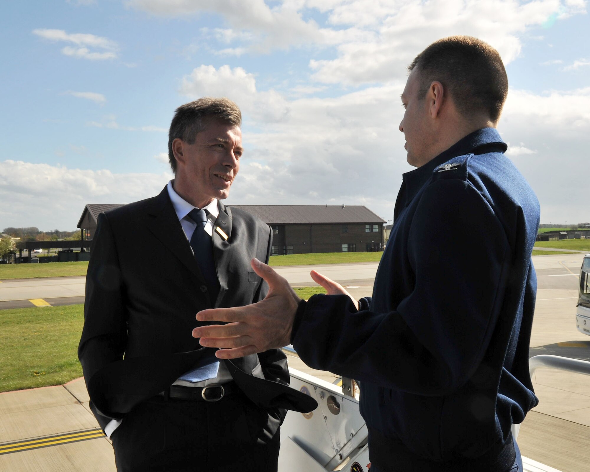 RAF MILDENHALL, England - Col. Joseph Rushlau, 100th Maintenance Group commander, speaks with Professor Christoph Loch during a tour of a KC-135 Stratotanker aircraft on the flightline here April 26, 2012. Twenty-one distinguished members of the local community were inducted into the base Honorary Commander program; Loch assumed the role of 100th MXG Honorary Commander. (U.S. Air Force photo/Senior Airman Jerilyn Quintanilla)