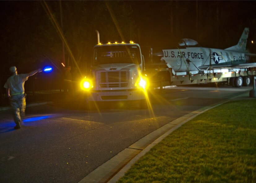 An F-86L Sabre is guided onto Moody Air Force Base, Ga., on April 25, 2012 where it will be restored and displayed at the George W. Bush Air Park at Moody Field. Restoration of the aircraft is estimated at almost 550 total man hours and just over $6,000 in material costs. This process will include inspections; corrosion removal; metal, structural and canopy repairs; and painting. (U.S. Air Force photo by Senior Airman Eileen Meier/Released)

