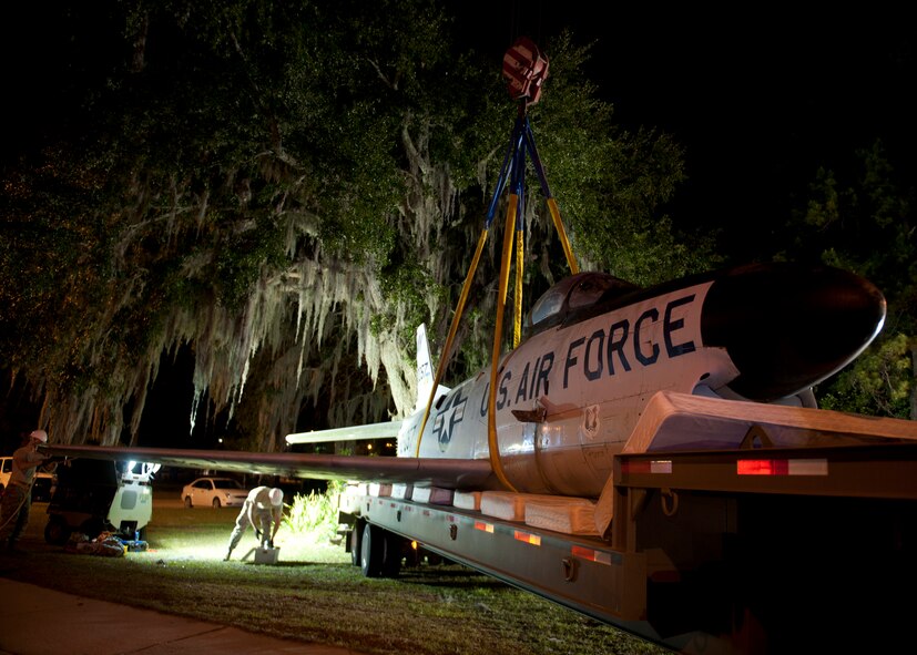 An F-86L Sabre rests on a flatbed trailer padded with mattresses in Valdosta, Ga. on April 24, 2012. Airmen from Moody Air Force Base coordinated with city officials and family of the late Maj. Lyn McIntosh, a Valdosta native killed during a rescue attempt in Iran in 1980.  After refurbishment, the aircraft will be displayed in the George W. Bush Air Park at Moody Field. (U.S. Air Force photo by Senior Airman Eileen Meier/Released)