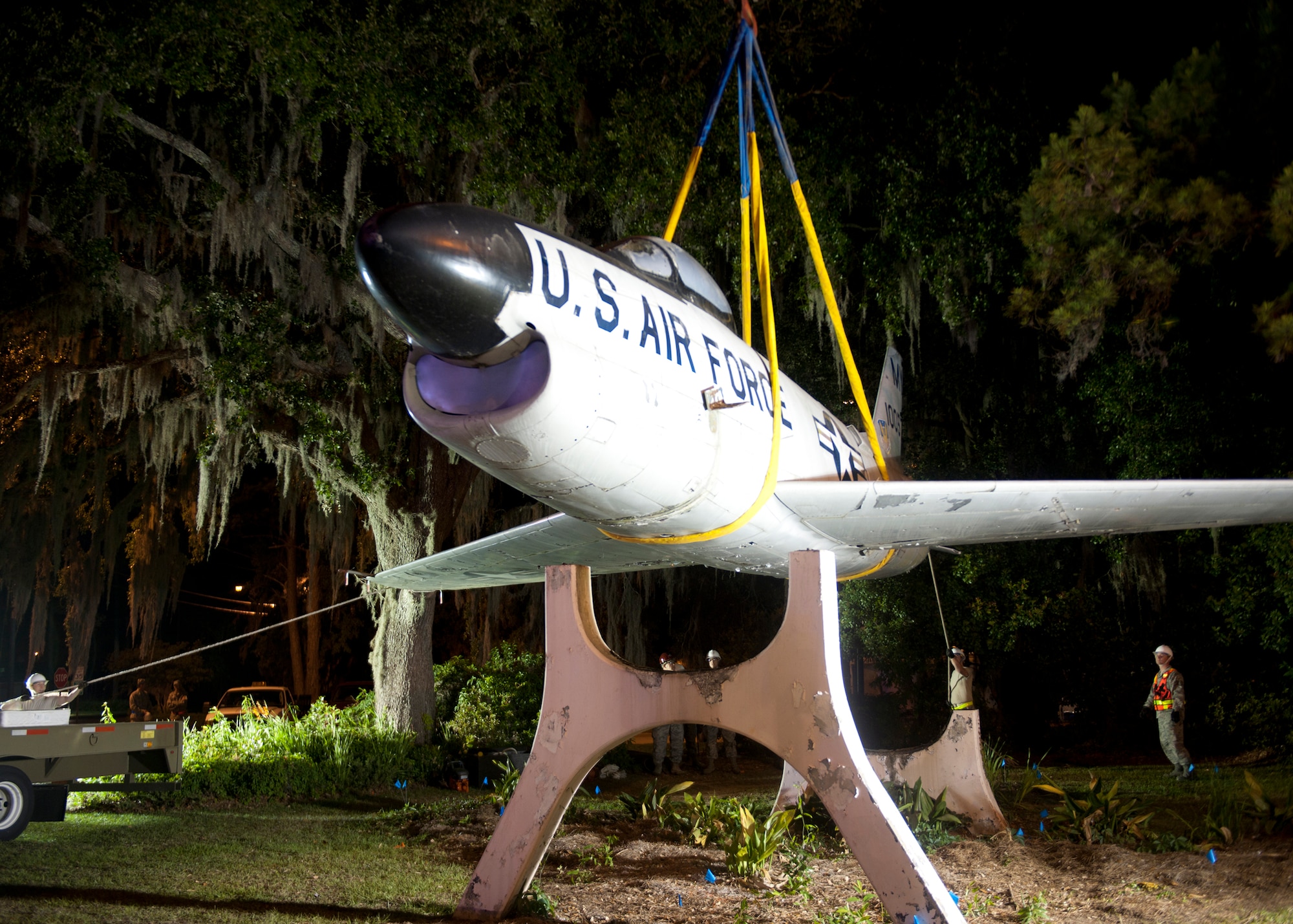 An F-86L Sabre is lifted off its mount in downtown Valdosta, Ga., and onto a flatbed trailer April 24, 2012. The historic aircraft is being moved to Moody Air Force Base, Ga., where it will be restored and displayed at the George W. Bush Air Park at Moody Field. (U.S. Air Force photo by Senior Airman Eileen Meier/Released)