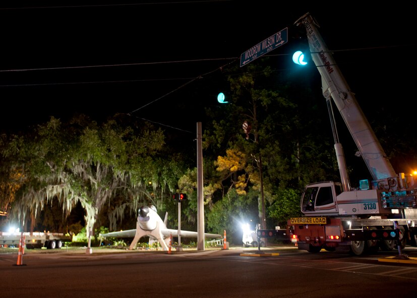 A crane lifts an F-86L Sabre onto a flatbed trailer for transport to Moody Air Force Base April 24, 2012. The aircraft has served as a landmark and memorial to the citizens of Valdosta, Ga. for many years, and will now be refurbished by team Moody and added to the George W. Bush Air Park at Moody Field. (U.S. Air Force photo by Senior Airman Eileen Meier/Released)