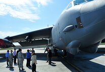 MINOT AIRFORCE BASE, N.D.  - - Senior Airman Jaime Torres, 5th Aircraft Maintenance Squadron crew chief, gives a tour of a B-52 static display during a Rating Agency visit, here April 25. The tour was to assess the value of the loan that will make housing privatization possible. (U.S. Air Force photo by Senior Airman Desiree W. Esposito)