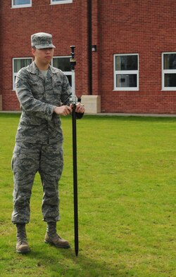 RAF MILDENHALL, England – Senior Airman Young Park, 100th Civil Engineer Squadron Geobase flight, holds a prism level April 16, 2012, outside Building 680, to ensure it lines up perfectly with the GPS total station, so longitude and latitude coordinates, and elevation above sea level points can be taken. The information is used to help with building design, and command and control. (U.S. Air Force photo/Karen Abeyasekere)