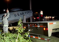 U.S. Air Force Tech. Sgt. John Turner, 23d Logistics Readiness Squadron, guides a flatbed trailer into position for an F-86L Sabre to be transported to Moody Air Force Base, Ga., April 24, 2012. The aircraft is a memorial for late Maj. Lyn McIntosh, a Valdosta native killed during a rescue attempt for American hostages in Iran in 1980. (U.S. Air Force photo by Senior Airman Eileen Meier/Released)