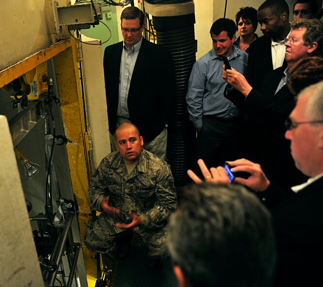 MINOT AIRFORCE BASE, N.D.  - - Tech Sgt. Javier Martinez, 91st Maintenance Operations Squadron trainer maintainer, gives a U-1 launch control trainer briefing to the Rating Agency visitors, here April 25. The tour was to assess the value of the loan that will make housing privatization possible. (U.S. Air Force photo by Senior Airman Desiree W. Esposito)