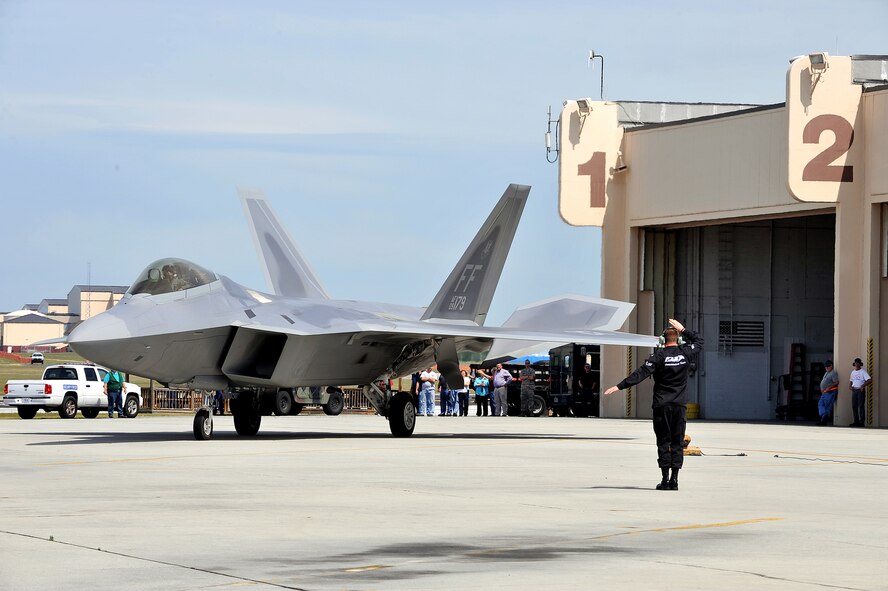 The F-22 Raptor arrived here in advance of the upcoming air show, where it will perform an aerial demonstration. The F-22 Raptor is the Air Force’s newest fighter aircraft. Its combination of stealth, supercruise, maneuverability, and integrated avionics, coupled with improved supportability, represents an exponential leap in warfighting capabilities. (U.S. Air Force photo by Tommie Horton)