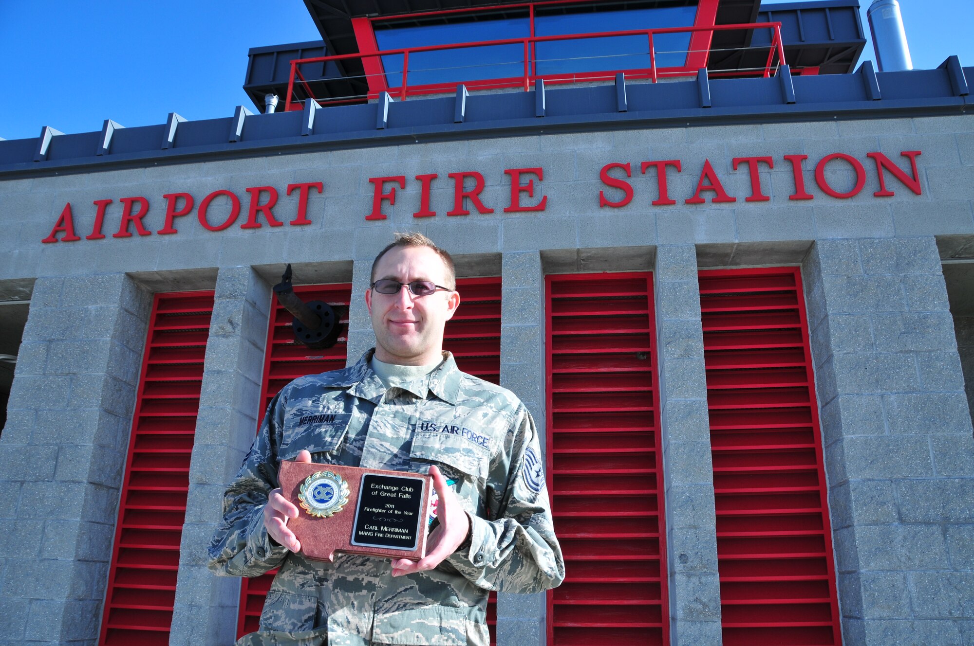 Tech. Sgt. Carl Merriman holds his award for Exchange Club Firefighter of the Year. The prestigious annual award is given to the most deserving firefighter from the MTANG, Malmstrom Air Force Base and the city of Great Falls.
 (U.S. Air Force photo by Master Sgt. Jason Johnson)