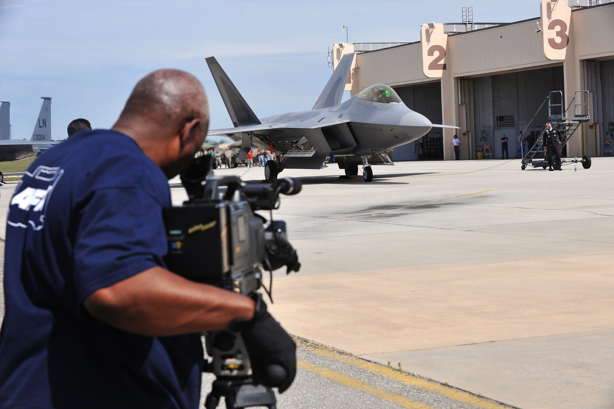 Local media gets a glimpse of the F-22 Raptor, which arrived here in advance of the upcoming air show. The F-22 Raptor is the Air Force’s newest fighter aircraft. Its combination of stealth, supercruise, maneuverability, and integrated avionics, coupled with improved supportability, represents an exponential leap in warfighting capabilities. (U.S. Air Force photo by Tommie Horton)