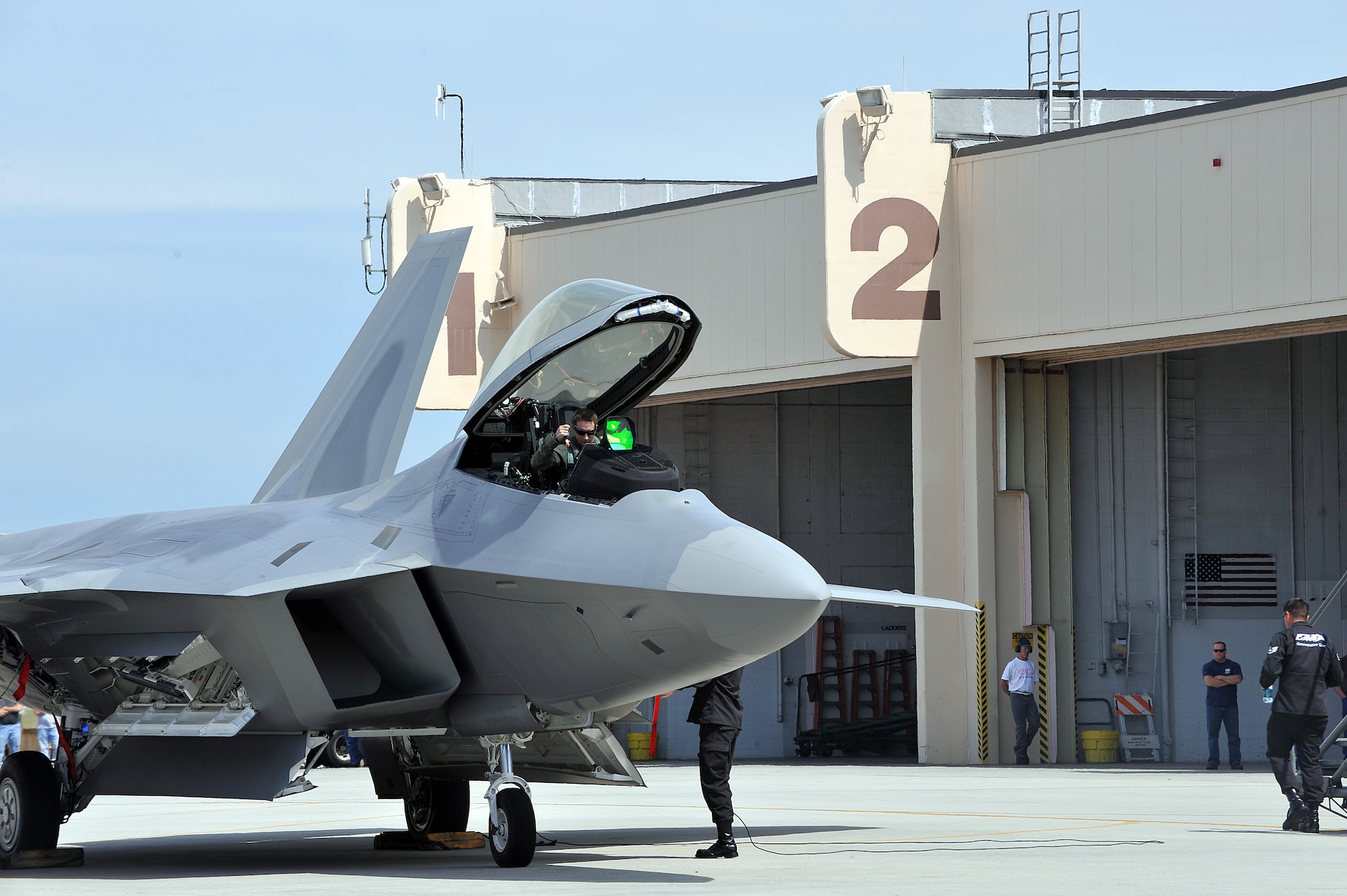 The F-22 Raptor sits on the Robins flightline.  The aircraft arrived here in advance of the upcoming air show, where it will perform an aerial demonstration. The F-22 Raptor is the Air Force’s newest fighter aircraft. Its combination of stealth, supercruise, maneuverability, and integrated avionics, coupled with improved supportability, represents an exponential leap in warfighting capabilities.  (U.S. Air Force photo by Tommie Horton)