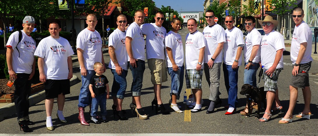 Airmen from Langley Air Force Base, Va., raise awareness to sexual violence by participating in the annual “Walk a Mile in Her Shoes” event in Hampton, Va., April 14, 2012.  The march is held annually during Sexual Assault Awareness month as a “fun and entertaining way to bring awareness to the fight against sexual violence.”  (U.S. Air Force photo by Airman 1st Class Kayla Newman/Released)