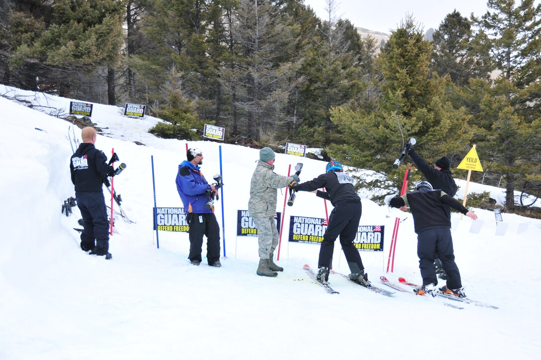 Montana Air National Guard Recruiter Tech. Sgt. Andy English (center) assists a participant competing in the biathlon event during the Park Riders Roundup held at the Great Divide Ski Area March 24, 2012. (U.S. Air Force photo by Staff Sgt. Michael Touchette)