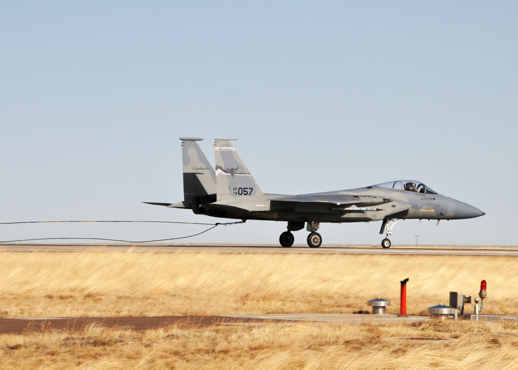 A Montana Air National Guard F-15 Eagle catches the aircraft arresting cable of the Barrier Arresting Kit 12/14 cable with its tail hook during the certification engagement exercise held at the Great Falls International Airport on March 4, 2012. (U.S. Air Force photos by Senior Master Sgt. Eric Peterson)