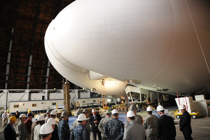 Distinguished visitors from U.S. Transportation Command view the U.S. Army's Hybrid Airship, an intelligence, surveillance and reconnaissance platform developed by Northrop Grumman April 25, 2012 at Joint Base McGuire-Dix-Lakehurst, N.J. General Fraser joined was accompanied by other joint service flag officers for a TRANSCOM conference at JB MDL. (U.S. Air Force photo/Tech. Sgt. Zachary Wilson)
