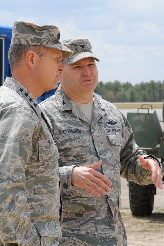 Gen. William Fraser, U.S. Transportation Command commander, discusses bare base operations capabilities with Col. Chris Patterson, 621st Contingency Response Wing commander April 25 at Joint Base McGuire-Dix-Lakehurst, N.J. General Fraser joined was accompanied by other joint service flag officers for a TRANSCOM conference at JB MDL. (U.S. Air Force photo by Tech. Sgt. Zachary Wilson/Released)